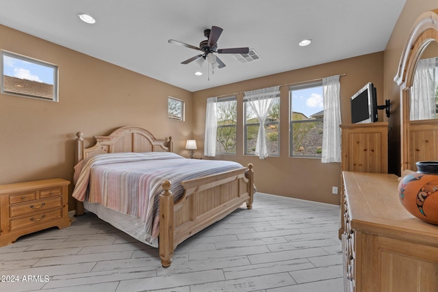 bedroom with ceiling fan and light wood-type flooring