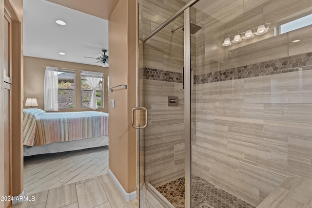 bathroom with walk in shower, tile floors, and ceiling fan