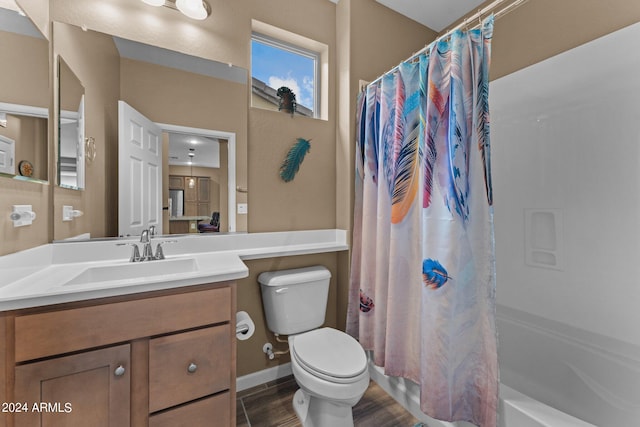 full bathroom with toilet, vanity with extensive cabinet space, and shower / tub combo with curtain