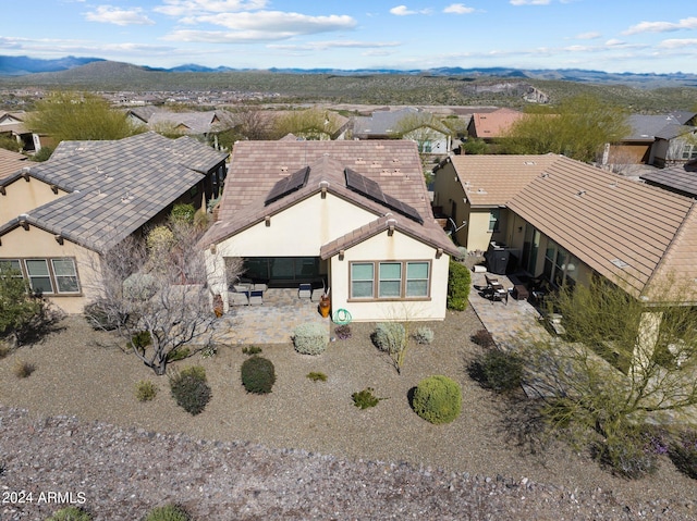 drone / aerial view featuring a mountain view