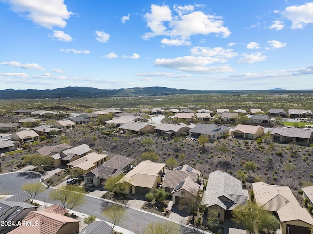 birds eye view of property featuring a mountain view