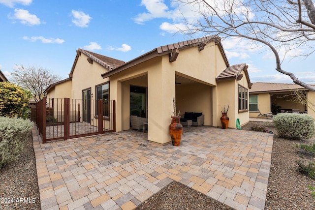 rear view of house featuring a patio area