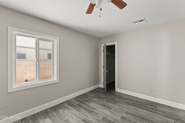 interior space featuring ceiling fan and dark hardwood / wood-style flooring