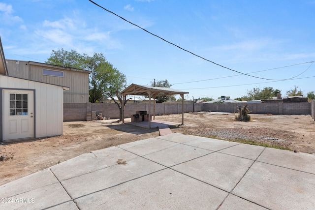 view of patio with an outbuilding