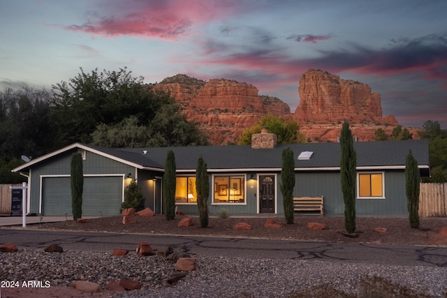 ranch-style house featuring a garage