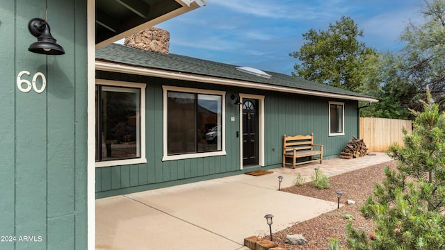 doorway to property with a patio