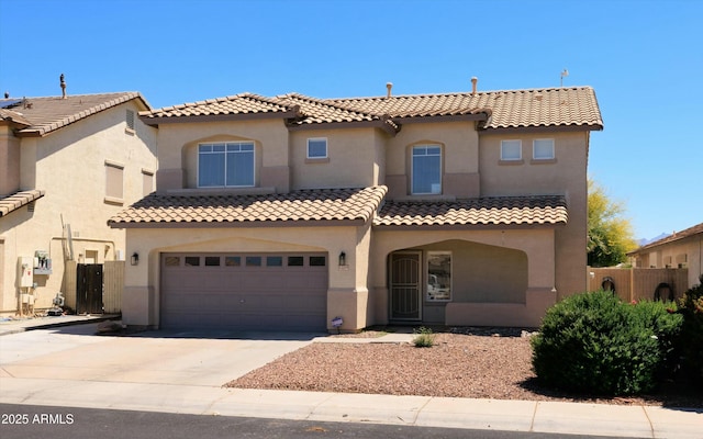 12209 W Washington St, Avondale, AZ 85323 - mediterranean / spanish-style house with driveway, fence, an attached garage, stucco siding, and a tile roof