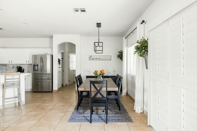 12209 W Washington St, Avondale, AZ 85323 - dining room with arched walkways, light tile patterned flooring, and recessed lighting