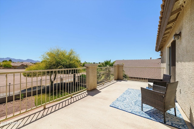 12209 W Washington St, Avondale, AZ 85323 - view of patio / terrace featuring a mountain view, a balcony, and fence