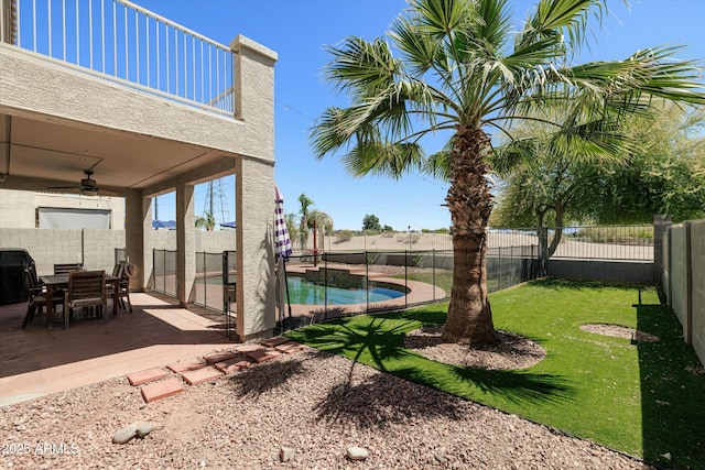 12209 W Washington St, Avondale, AZ 85323 - view of yard featuring ceiling fan and a patio