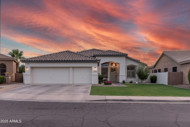 2982 S Holguin Way, Chandler, AZ 85286 - mediterranean / spanish home with stucco siding, an attached garage, a tile roof, and concrete driveway