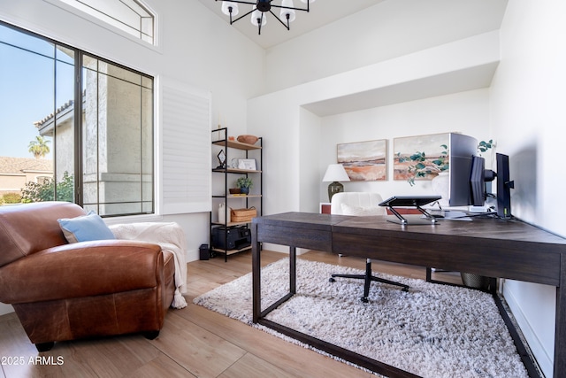 2982 S Holguin Way, Chandler, AZ 85286 - office featuring a chandelier, wood finished floors, and a high ceiling