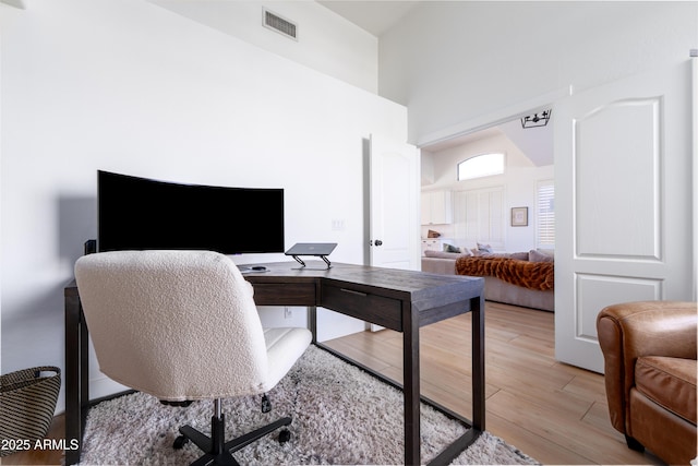 2982 S Holguin Way, Chandler, AZ 85286 - office space featuring a towering ceiling and light wood-style flooring