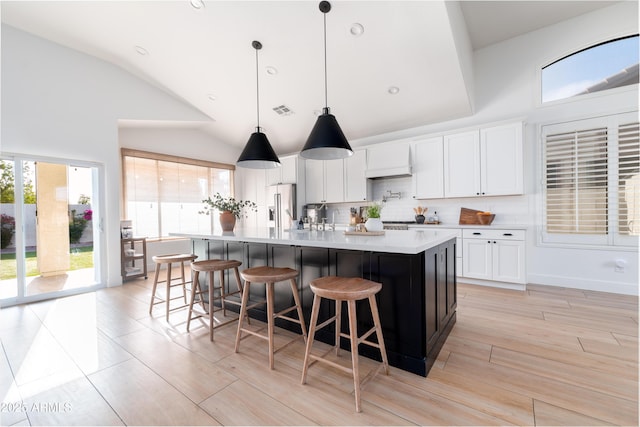 2982 S Holguin Way, Chandler, AZ 85286 - kitchen with high end fridge, backsplash, light countertops, a large island, and white cabinetry