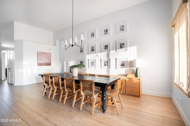 2982 S Holguin Way, Chandler, AZ 85286 - dining space featuring light wood-type flooring, baseboards, and a chandelier