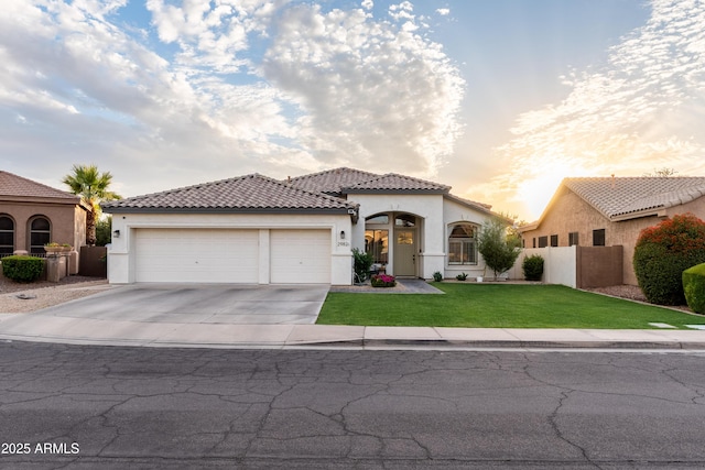 2982 S Holguin Way, Chandler, AZ 85286 - mediterranean / spanish-style house with stucco siding, a garage, driveway, and a tile roof