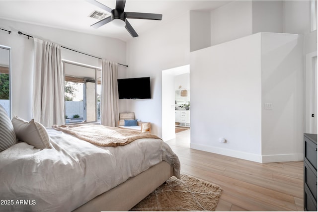 2982 S Holguin Way, Chandler, AZ 85286 - bedroom with light wood-style flooring, baseboards, ceiling fan, ensuite bath, and high vaulted ceiling