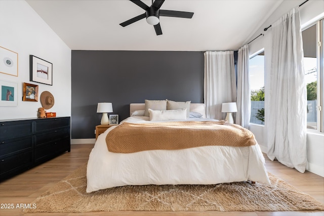 2982 S Holguin Way, Chandler, AZ 85286 - bedroom with light wood-type flooring, lofted ceiling, a ceiling fan, and baseboards