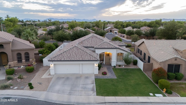 2982 S Holguin Way, Chandler, AZ 85286 - view of front facade featuring stucco siding, driveway, a garage, a tiled roof, and a mountain view