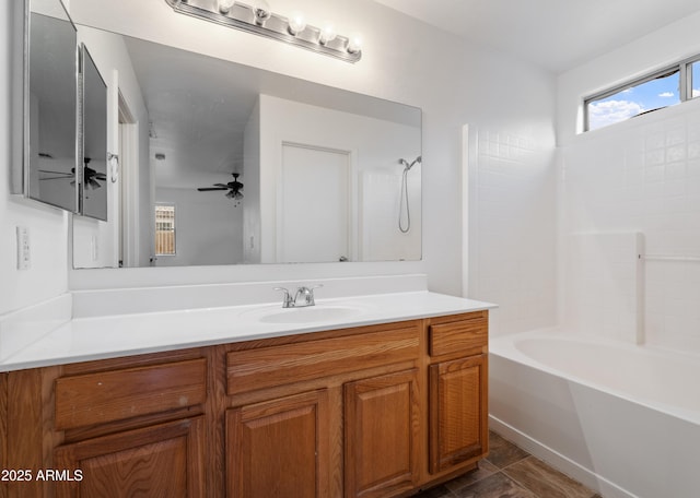 full bathroom featuring vanity, shower / tub combination, and ceiling fan