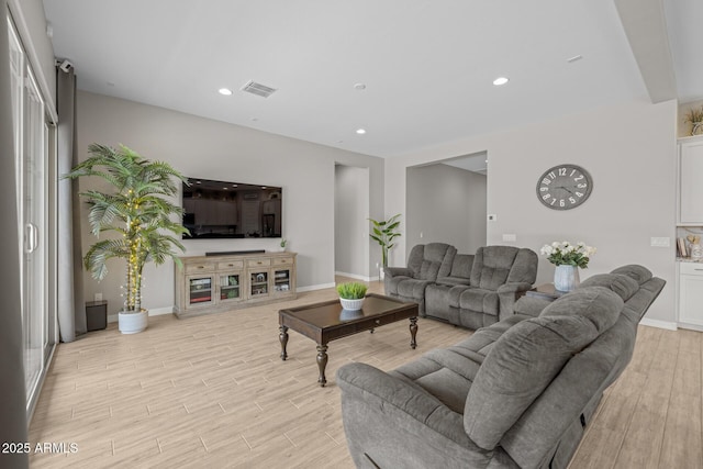 2343 E Kelly Dr, Gilbert, AZ 85298 - living area with light wood finished floors, baseboards, and recessed lighting