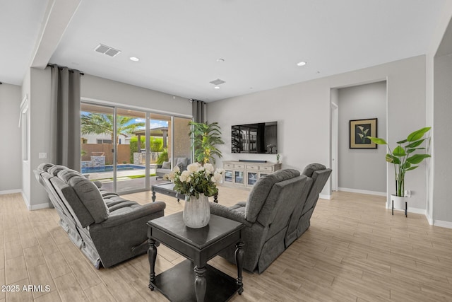 2343 E Kelly Dr, Gilbert, AZ 85298 - living room featuring baseboards, light wood-style floors, and recessed lighting