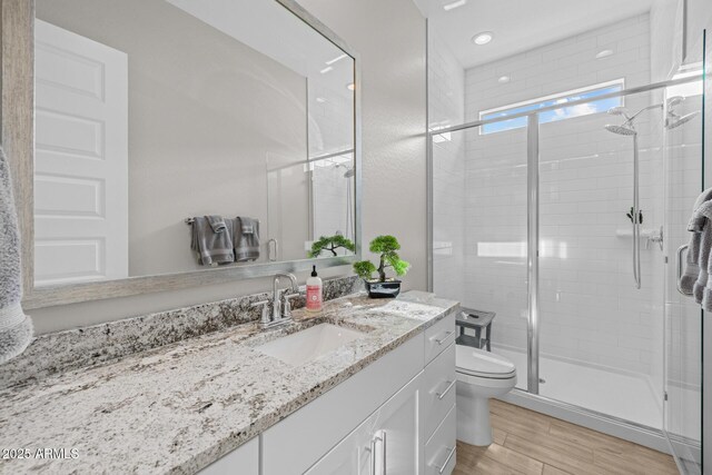 2343 E Kelly Dr, Gilbert, AZ 85298 - full bath with toilet, a shower stall, vanity, and wood finished floors