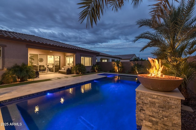 2343 E Kelly Dr, Gilbert, AZ 85298 - view of swimming pool featuring a patio, an outdoor living space with a fire pit, and a fenced backyard