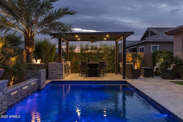 2343 E Kelly Dr, Gilbert, AZ 85298 - pool at dusk with ceiling fan, a patio, and a fenced backyard