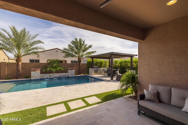 2343 E Kelly Dr, Gilbert, AZ 85298 - view of swimming pool featuring a gazebo, a patio, an outdoor living space, a fenced backyard, and an outdoor kitchen