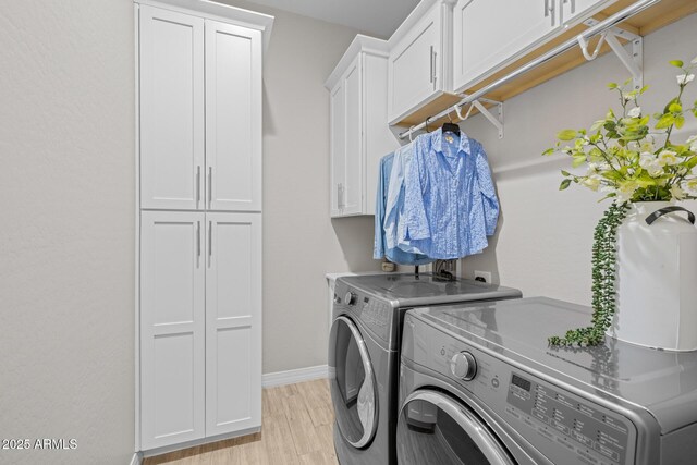 2343 E Kelly Dr, Gilbert, AZ 85298 - laundry room with cabinet space, washer and dryer, light wood-style flooring, and baseboards