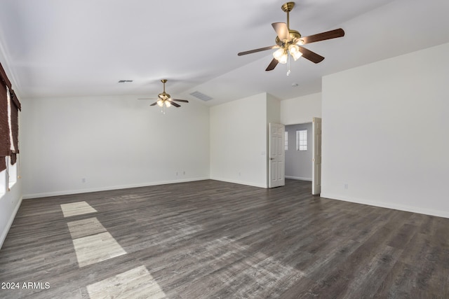 empty room featuring ceiling fan, lofted ceiling, and dark wood-type flooring