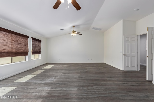 empty room featuring ceiling fan, dark wood-type flooring, and lofted ceiling