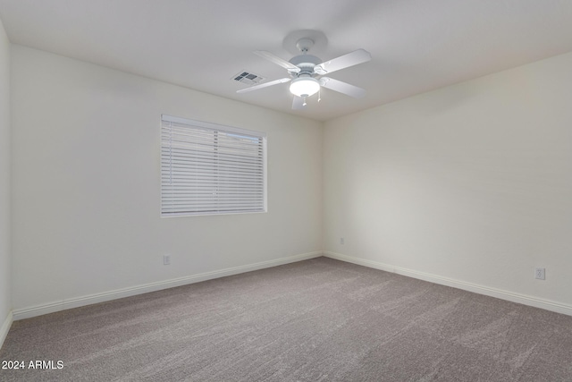 carpeted empty room with ceiling fan