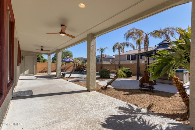 view of patio featuring ceiling fan