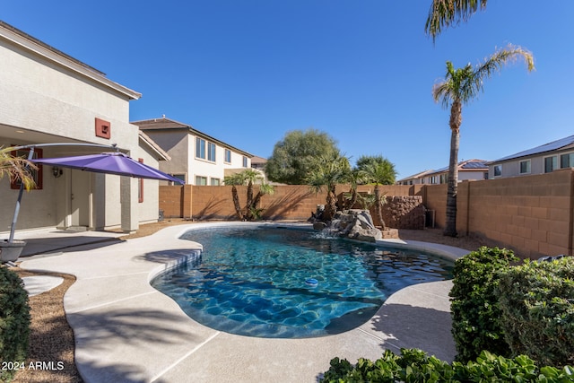 view of pool with a fenced in pool, a patio area, and a fenced backyard