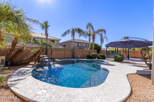 view of swimming pool featuring a patio area and pool water feature