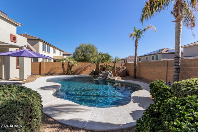 view of pool with pool water feature