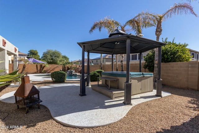 view of patio with a pool, a fenced backyard, and a gazebo