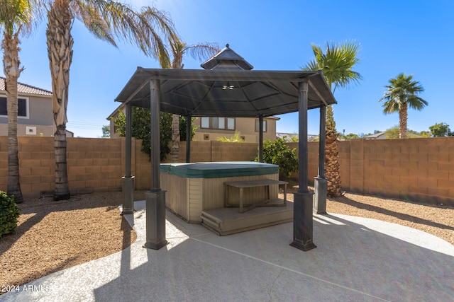 view of patio / terrace with a gazebo and a hot tub