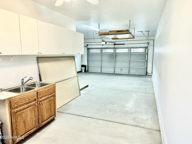 garage featuring a sink and baseboards