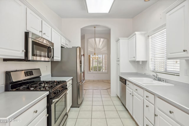 8426 W Utopia Rd, Peoria, AZ 85382 - kitchen featuring stainless steel appliances, a sink, and white cabinets
