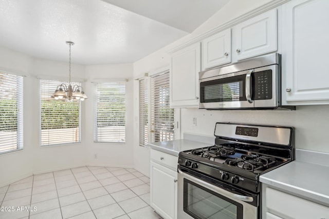 8426 W Utopia Rd, Peoria, AZ 85382 - kitchen featuring stainless steel appliances, a chandelier, light countertops, and white cabinetry