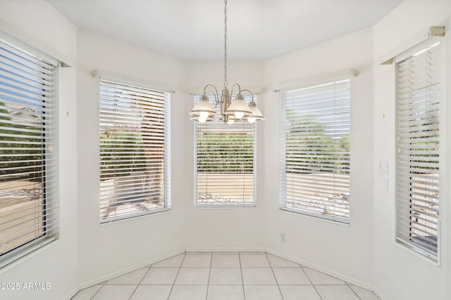 8426 W Utopia Rd, Peoria, AZ 85382 - unfurnished dining area with a chandelier, plenty of natural light, baseboards, and light tile patterned floors