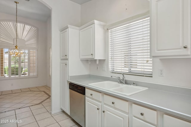 8426 W Utopia Rd, Peoria, AZ 85382 - kitchen with stainless steel dishwasher, a sink, a chandelier, white cabinetry, and light countertops
