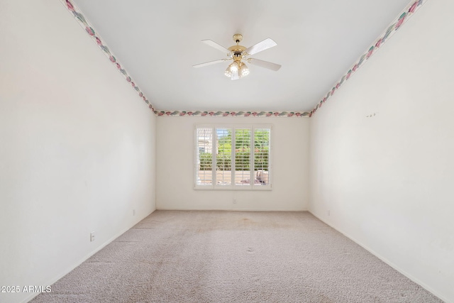 8426 W Utopia Rd, Peoria, AZ 85382 - spare room featuring light colored carpet, a ceiling fan, and baseboards