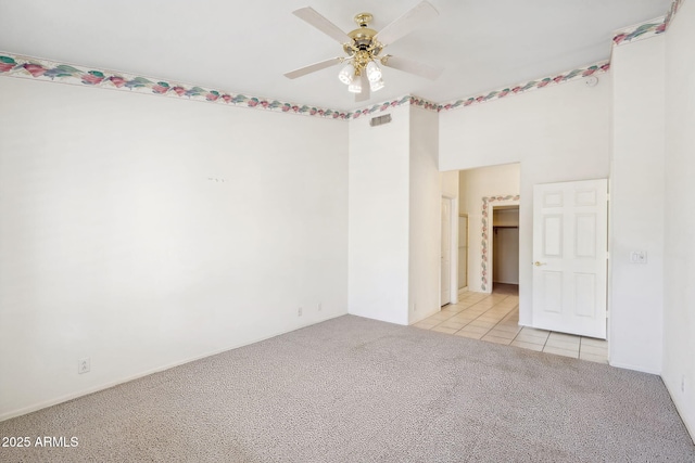 8426 W Utopia Rd, Peoria, AZ 85382 - empty room with carpet flooring, ceiling fan, and tile patterned flooring