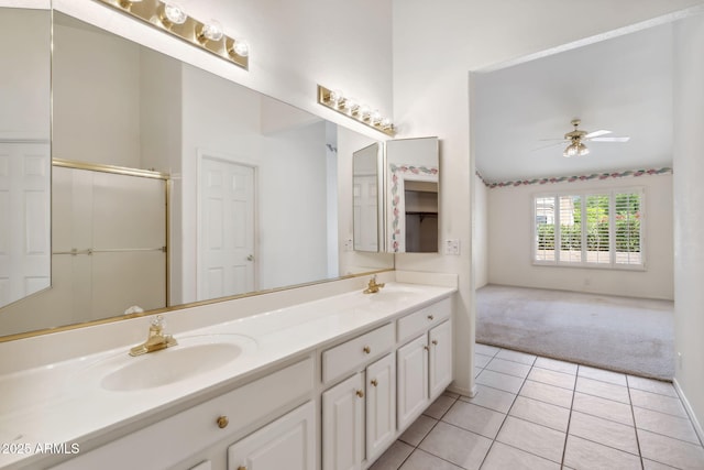 8426 W Utopia Rd, Peoria, AZ 85382 - bathroom featuring double vanity, tile patterned flooring, a ceiling fan, and an enclosed shower