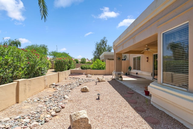 8426 W Utopia Rd, Peoria, AZ 85382 - fenced backyard with a ceiling fan and a patio area