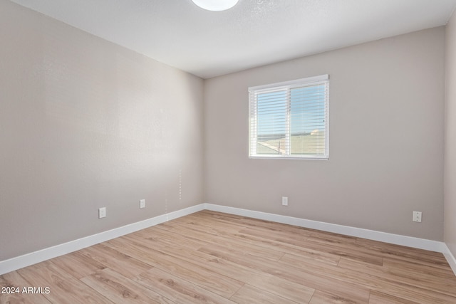 unfurnished room featuring light wood-type flooring